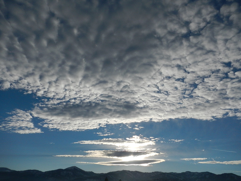 beautiful sun and clouds in winter big sky montana beautiful sun and clouds in winter big sky country montana
