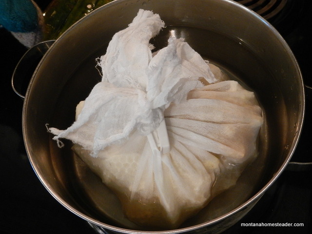 Melting and filtering honeycomb to render beeswax