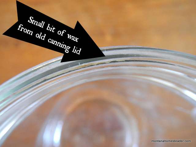Inspecting canning jar rim for leftover wax from old canning lid | Montana Homesteader