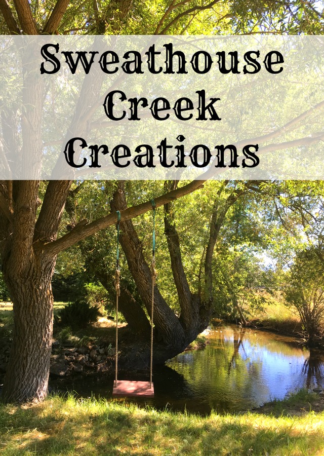 a peaceful mountain creek, Sweathouse Creek, flowing by a large willow tree with a red swing hanging from the tree