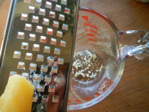 Grating beeswax for easy DIY natural lip balm recipe
