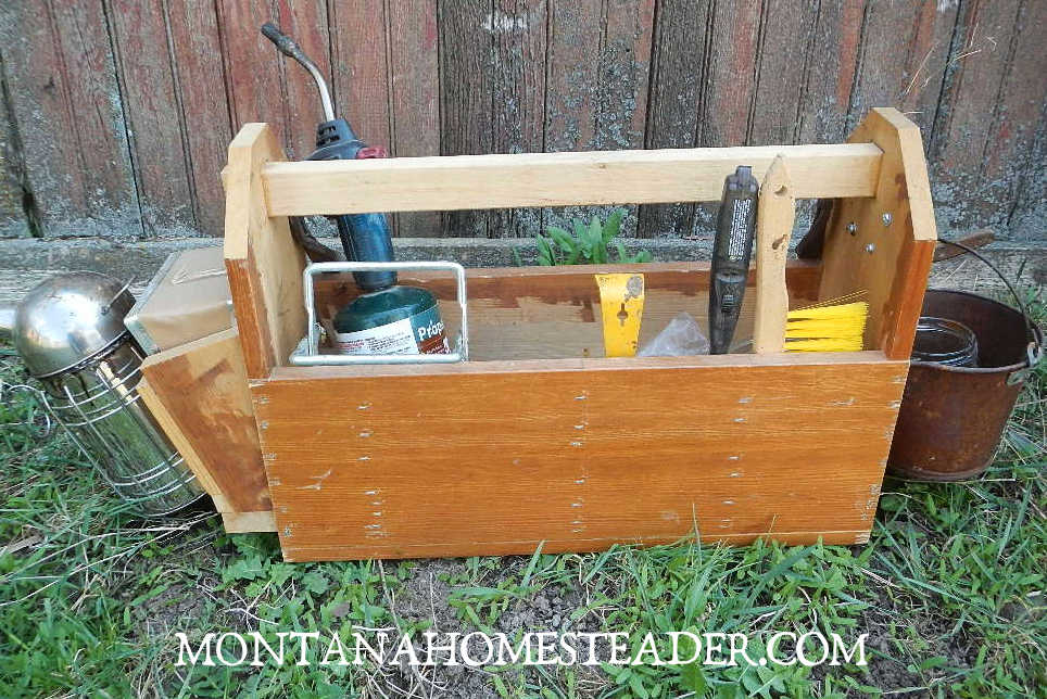 Supplies equipment and tools needed for beginner beekeepers beekeeping tool box to hold tools like hive tool smoker brush