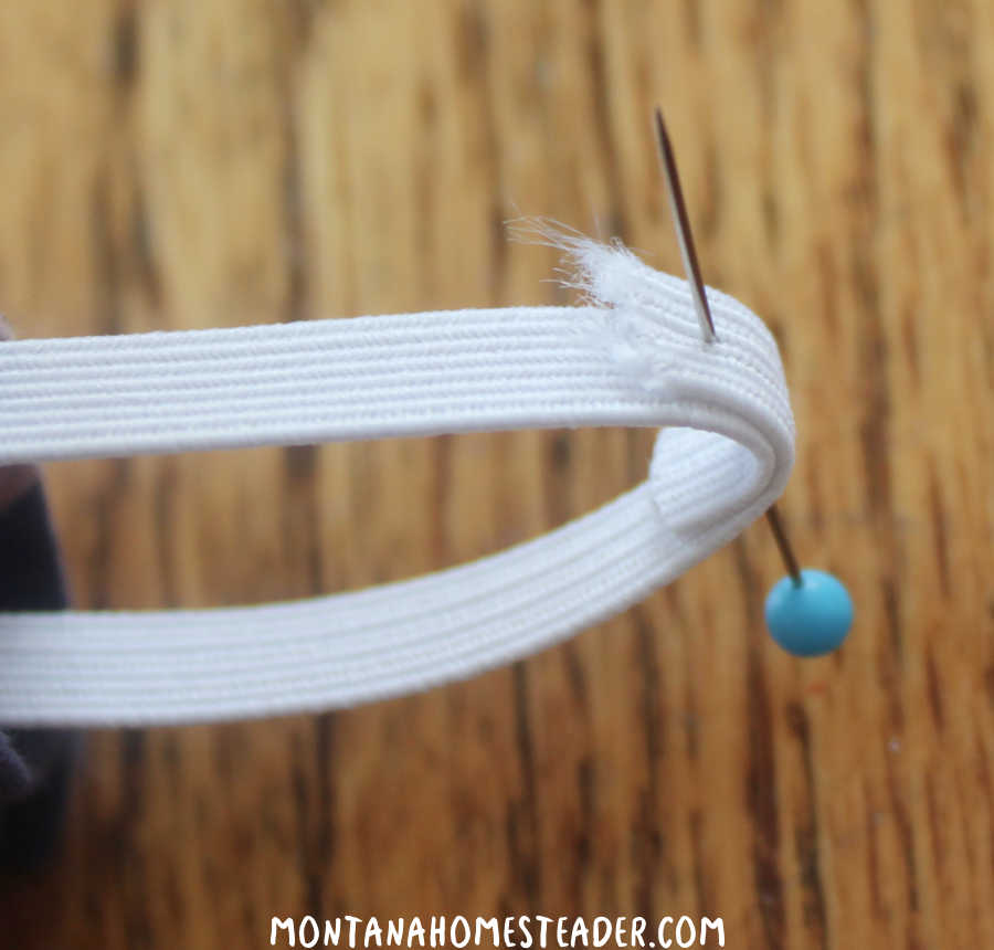 How to make an easy DIY hair scrunchie with step by step instructions showing how to feed the elastic through the tube overlap the elastic edges pin in place to sew the elastic together
