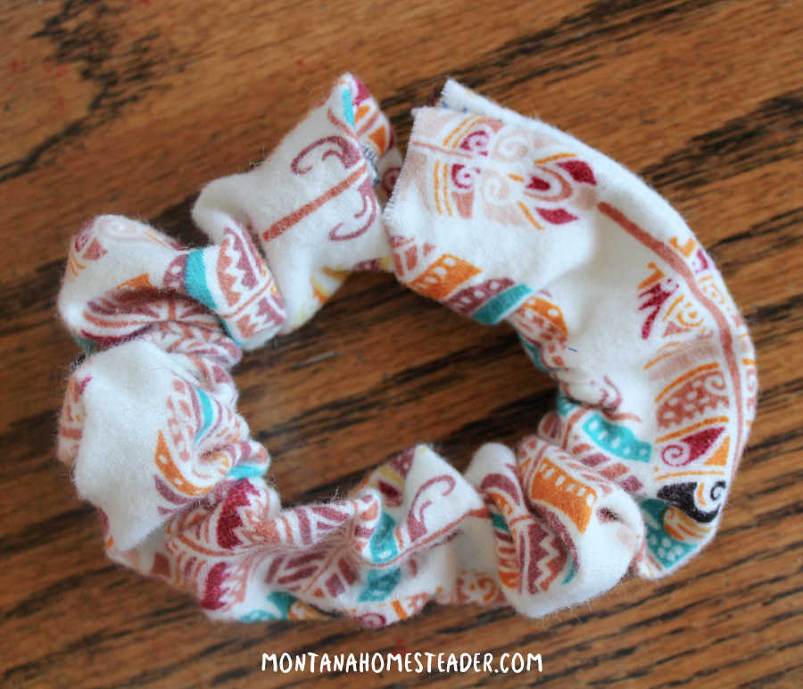 How to sew an easy hair scrunchie picture of scrunchie showing how to tuck one end of tube inside the other to hide the end and sew it together