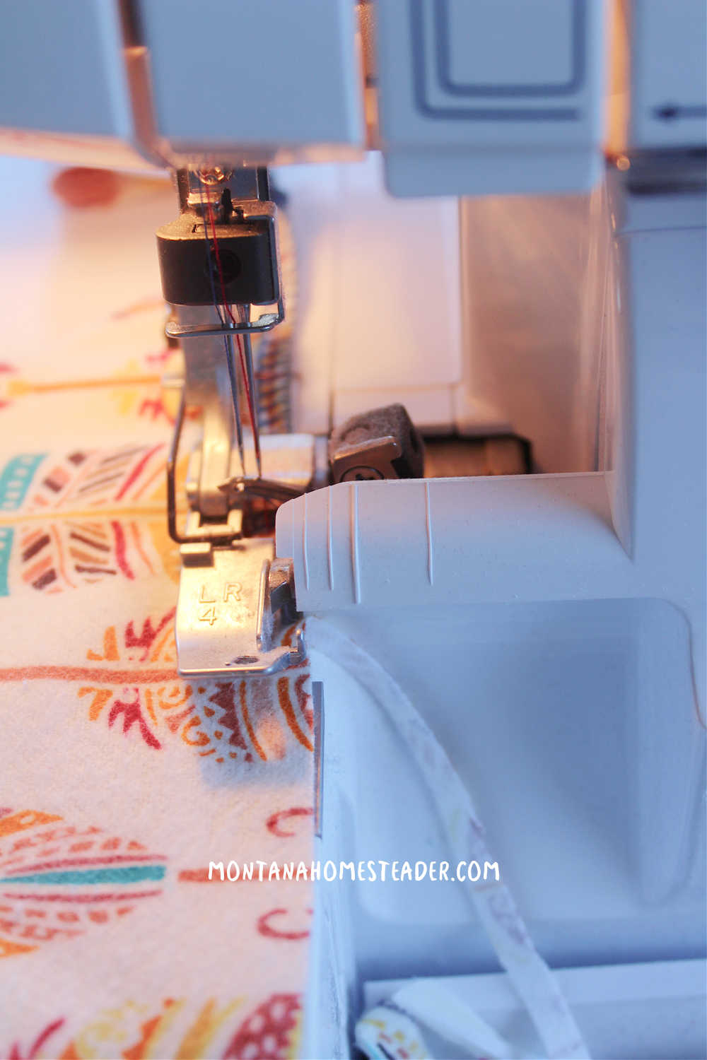 How to sew a simple tie on dog bandana serger sewing machine sewing raw edges of feather print dog bandana to prevent fabric from fraying