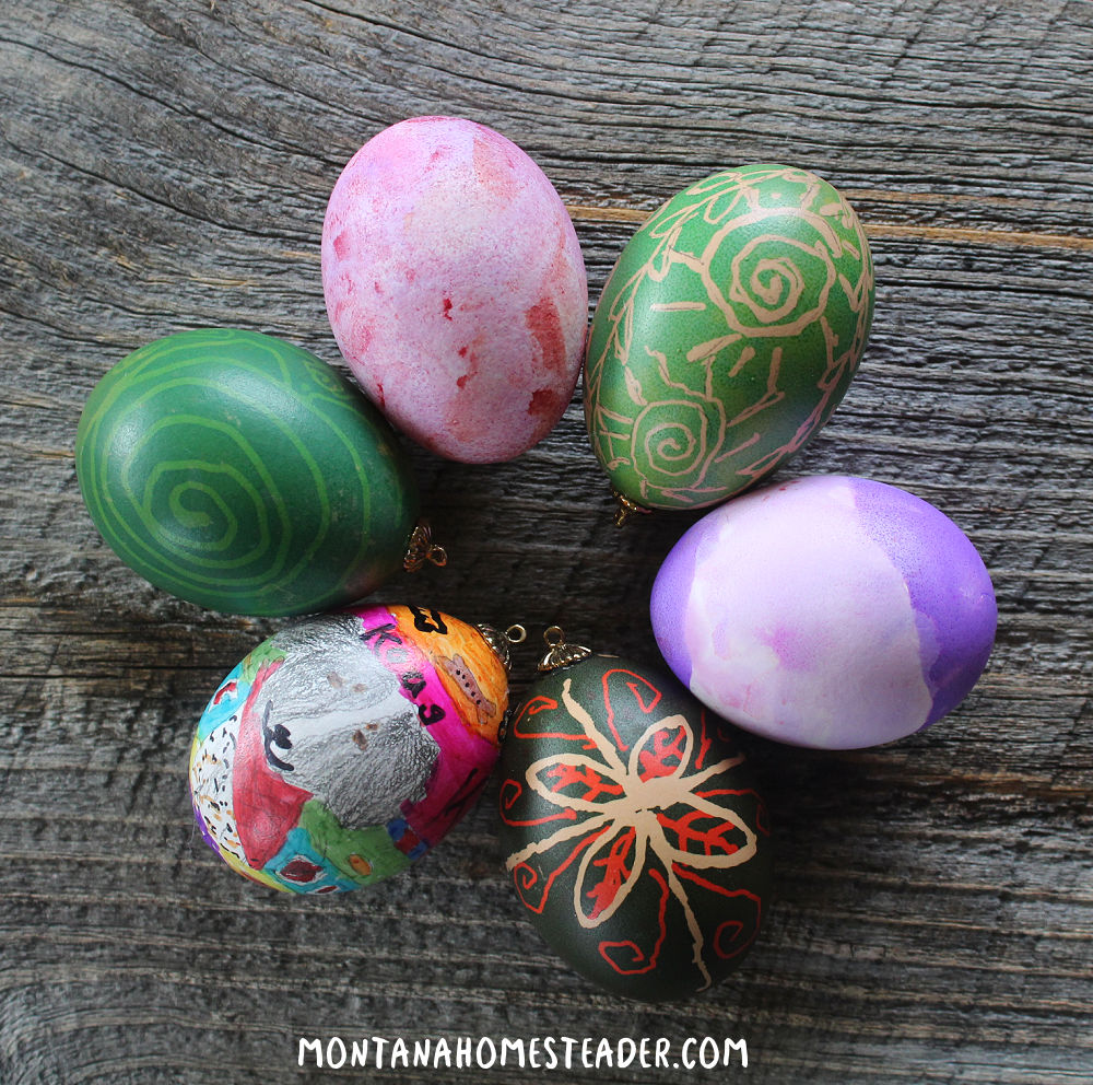 How to make blown egg ornaments how to decorate blown eggs Easter eggs Christmas ornaments circle of colorful blown eggs decorated with dye marker paint and pysanky